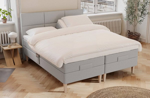 Ragna elevationsseng i grå